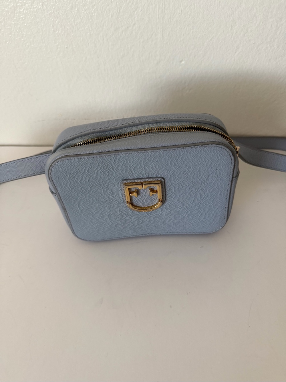 Furla Brava crossbody bag is crafted from light blue leather